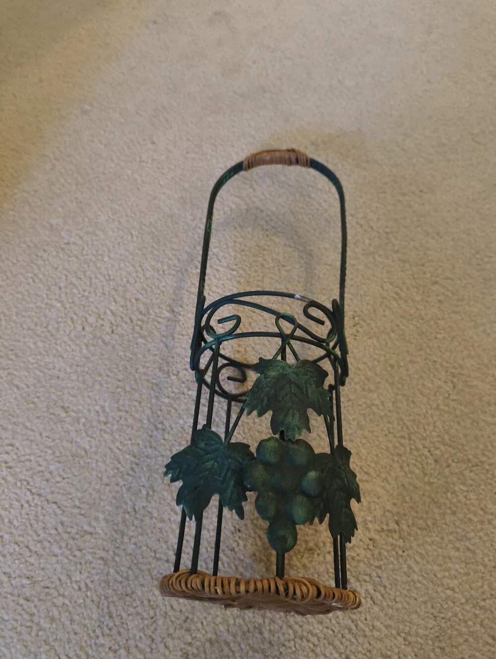 Green Metal Wine bottle Holder with Wicker Base and Leaves.